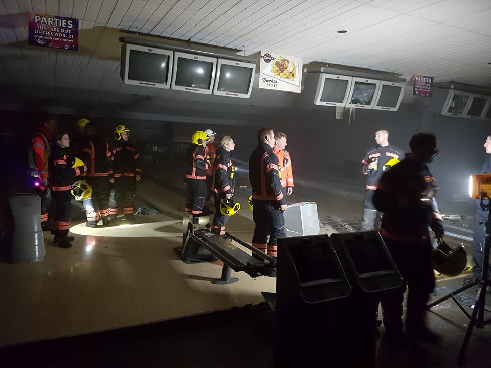 firefighters in a bowling alley