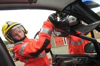 firefighter using cutting equipment