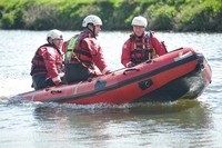 firefighters in boat