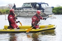 firefighters using rescue sled