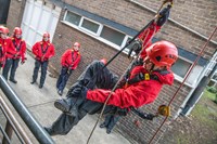 firefighter using rope rescue equipment