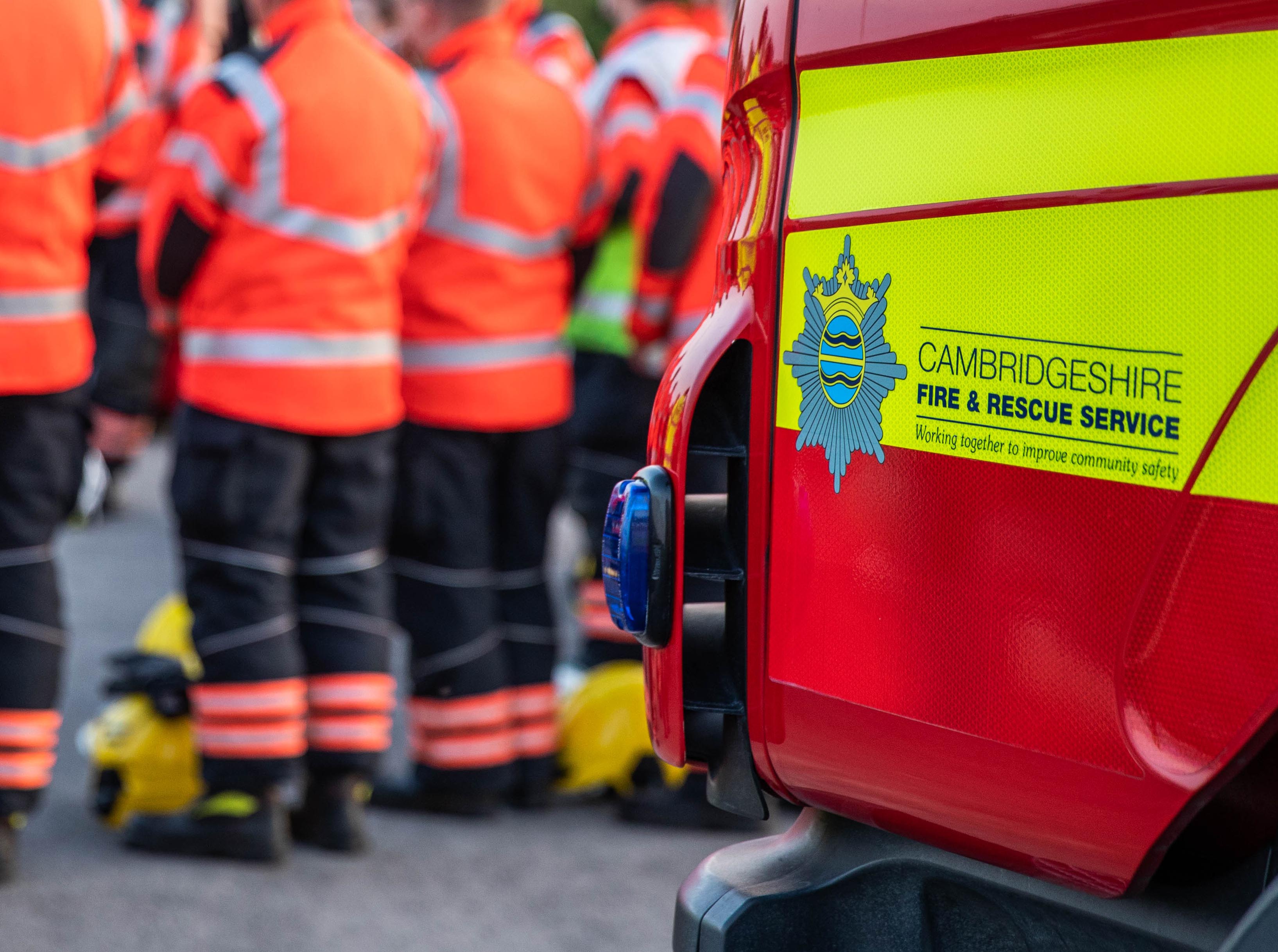 Firefighters near fire engine