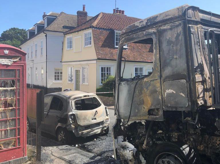 Lorry and car damage by a fire.