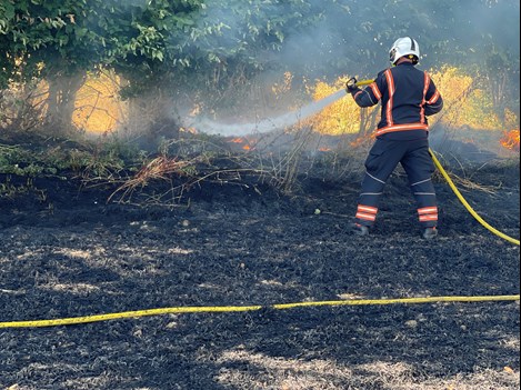 Firefighter at farm fire