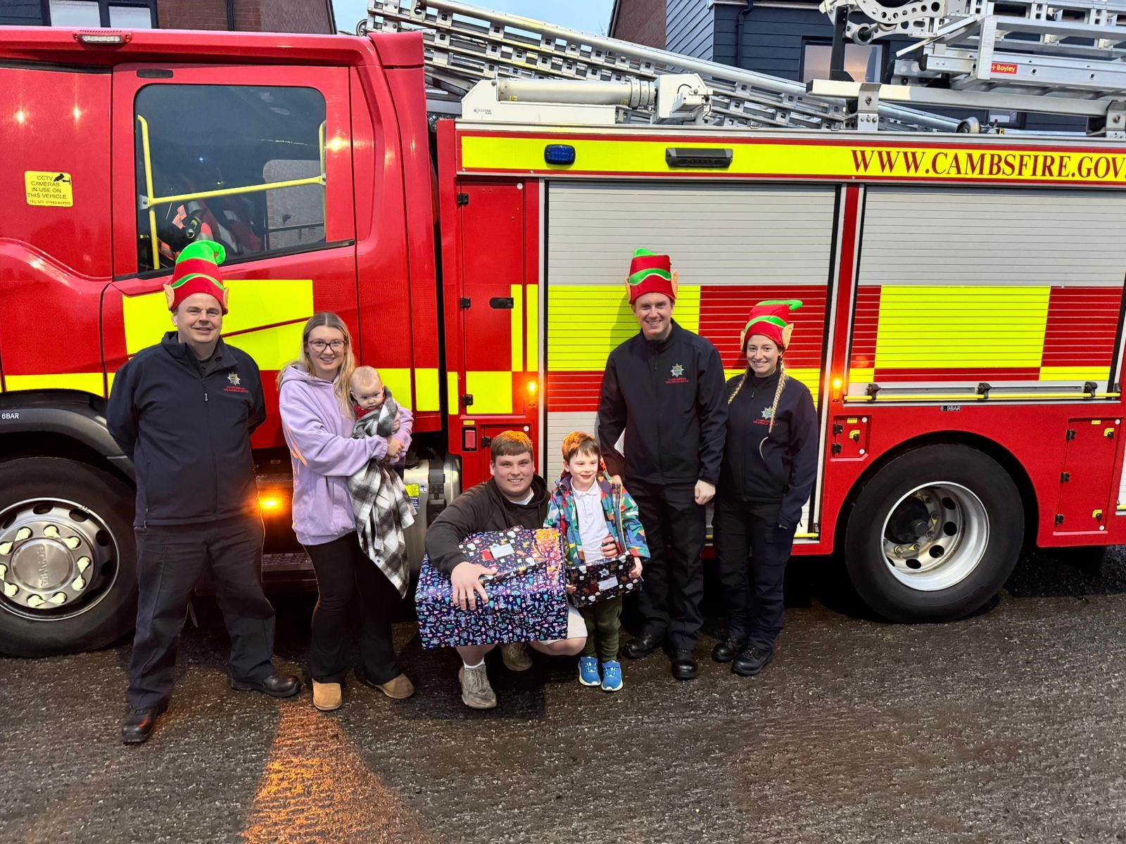 Firefighters donating gifts