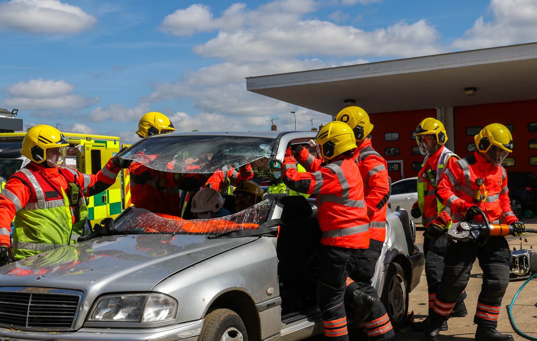 Firefighters training with car