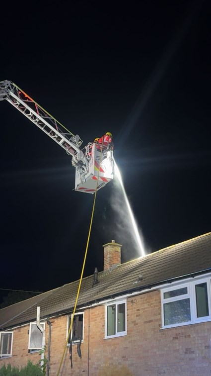Firefighter on aerial ladder appliance
