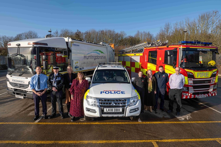 Photo of vehicles with representatives from each of the partners