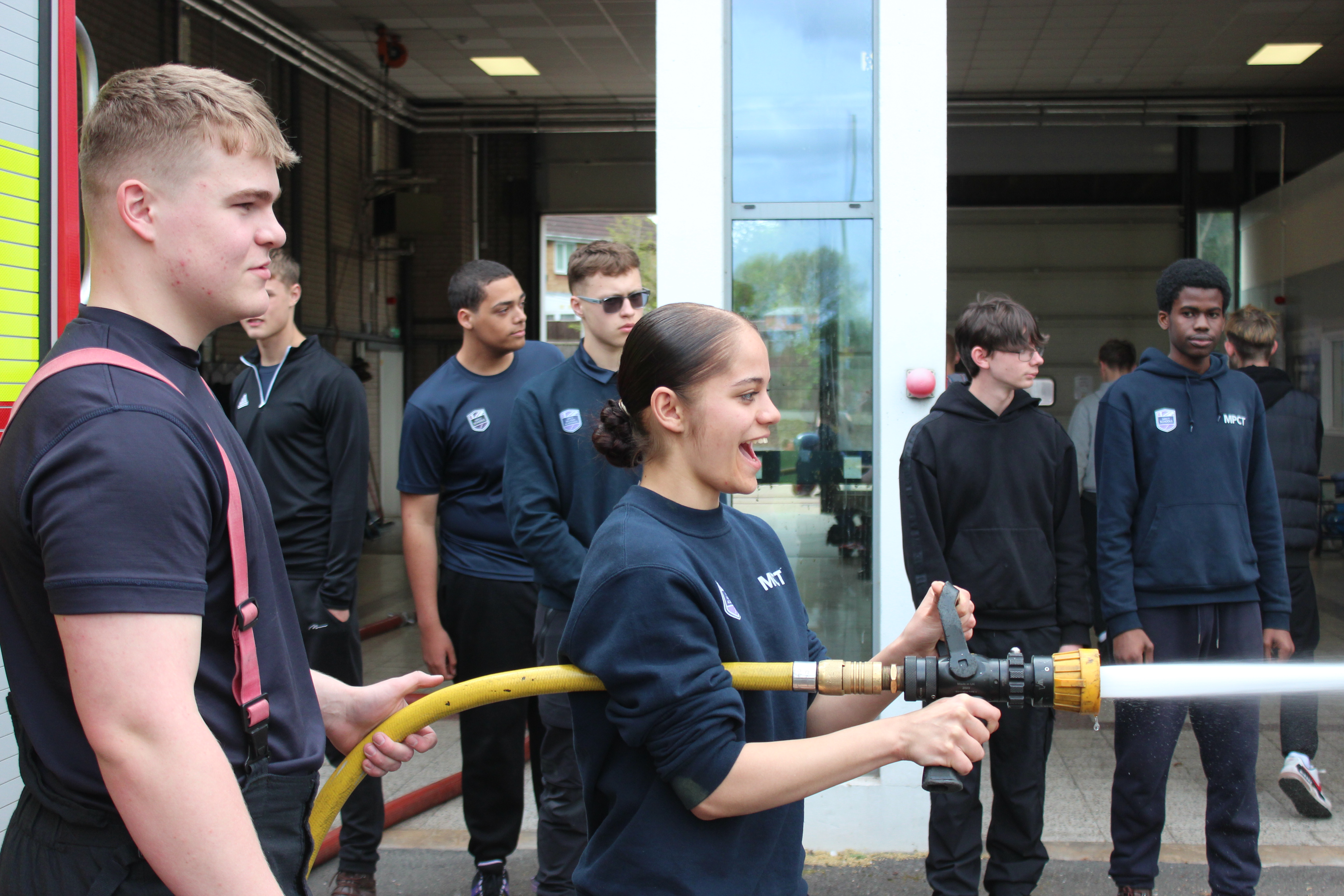 Firefighters with students