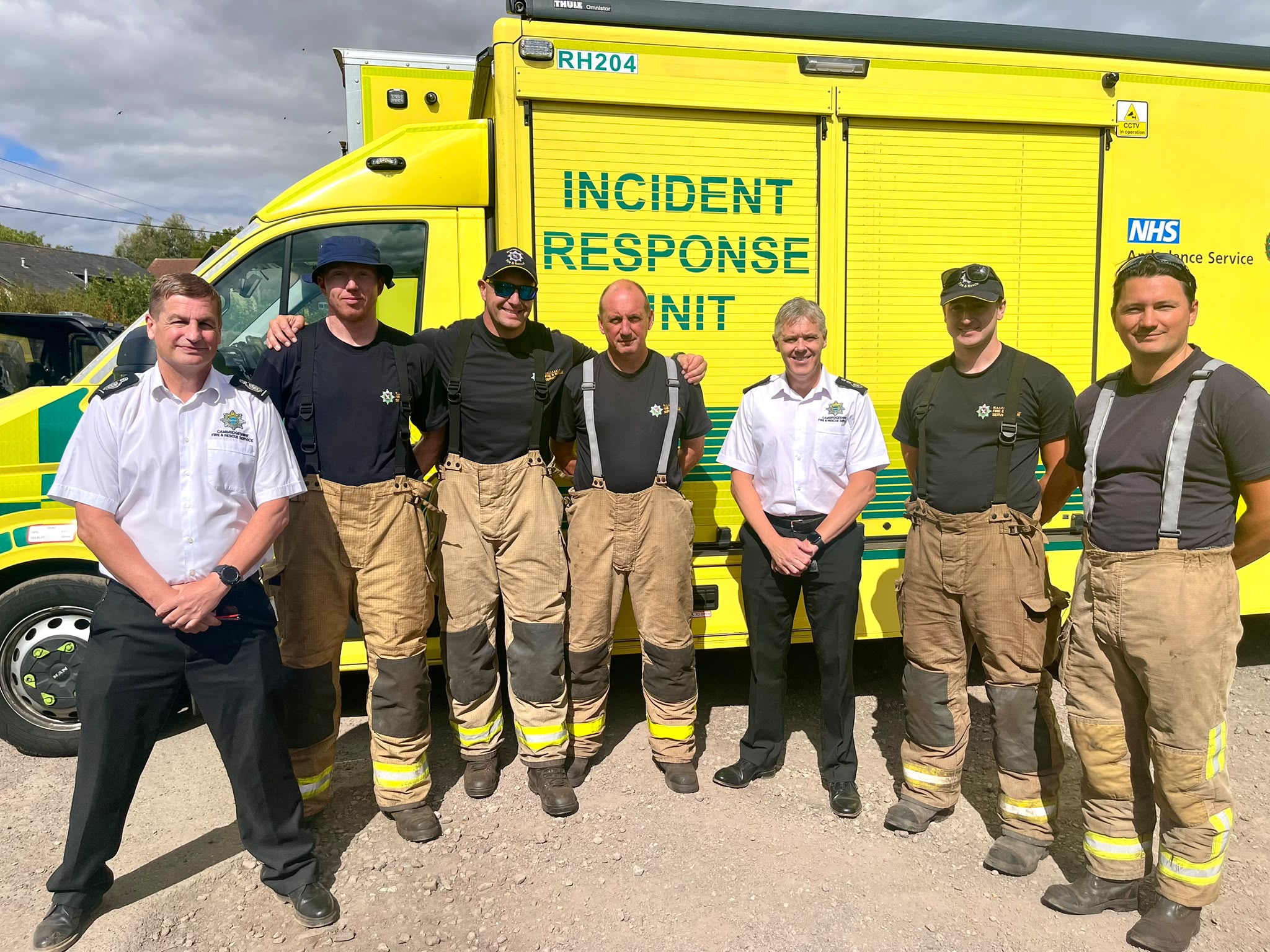 Deputy Chief Fire Officer Jon Anderson and Chief Fire Officer Matthew Warren standing with a national resilience crew.