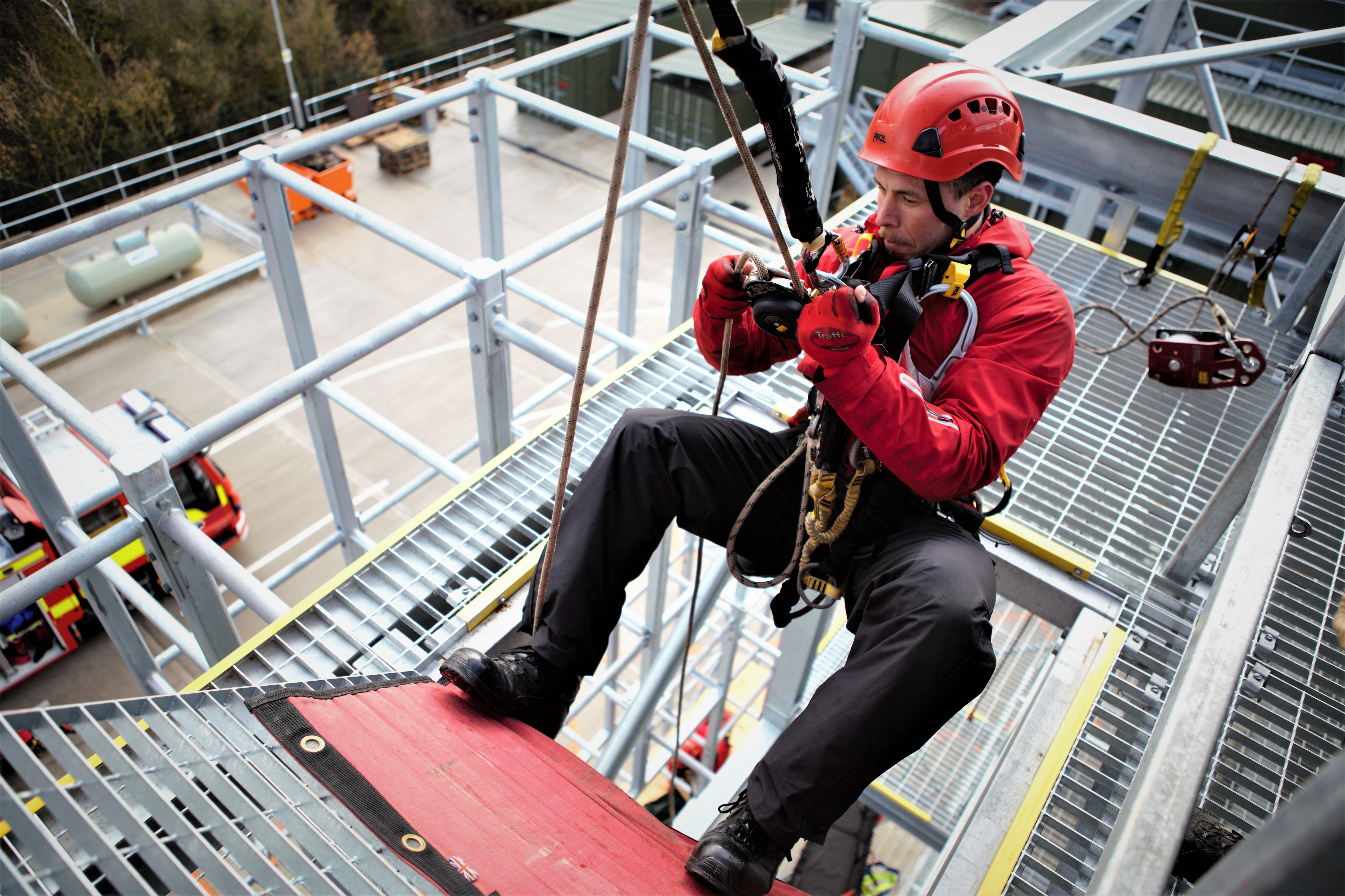 firefighter using rope rescue equipment